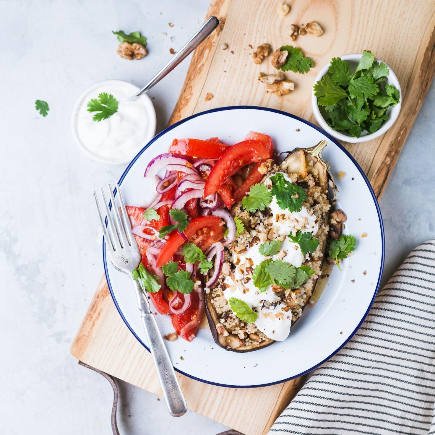 Diverse group of community members sharing a meal together, showcasing the social bonds formed through collaborative cooking
